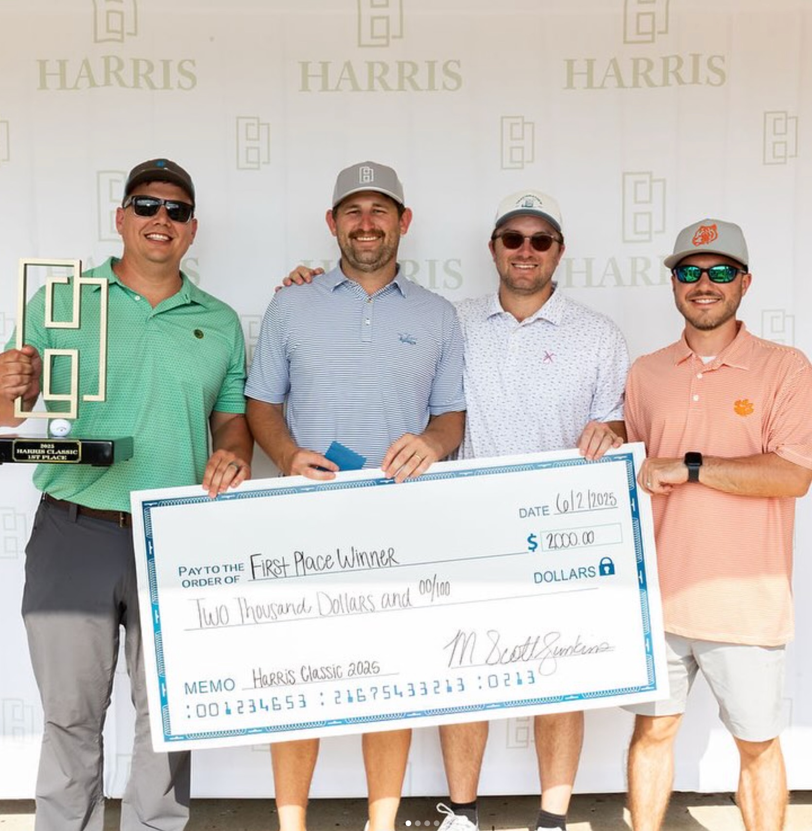 Harris team holding the first place check at the Harris Classic