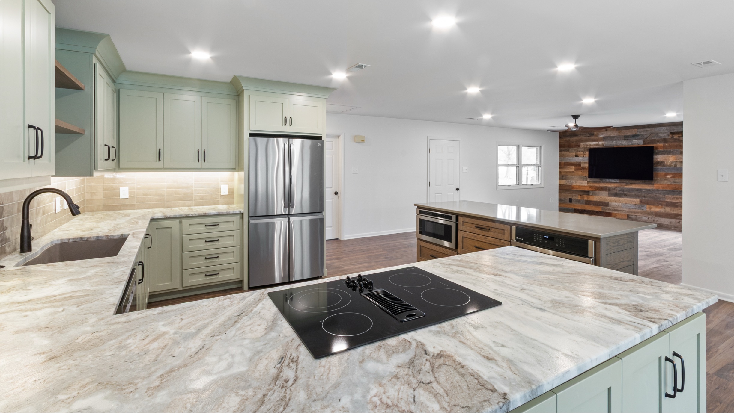 Open kitchen with a marble island