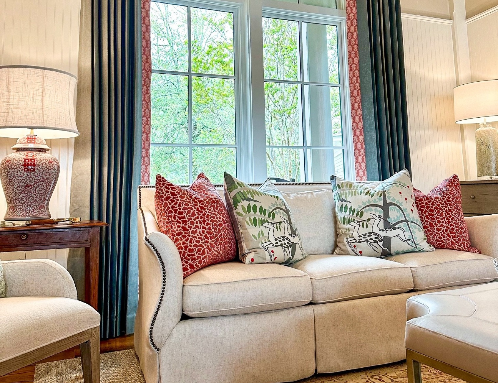 Living room with patterned pillows and drapery