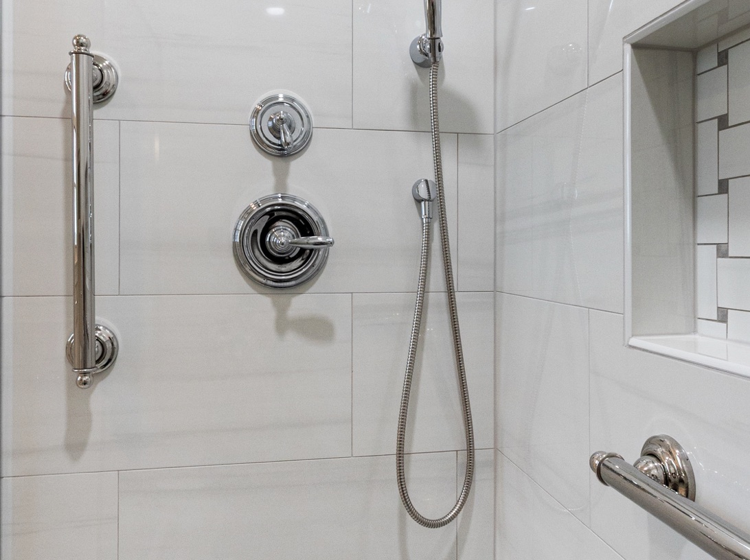 Tiled shower with brushed nickel fixtures